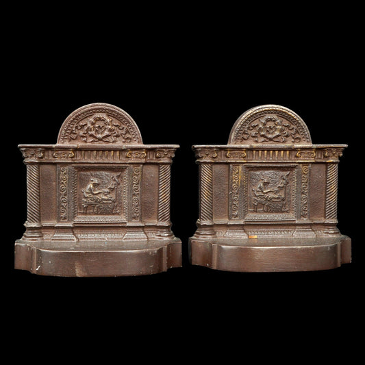 Pair of Bradley and Hubbard Iron Bookends with Spinning Scene Circa 1930 - Bear and Raven Antiques